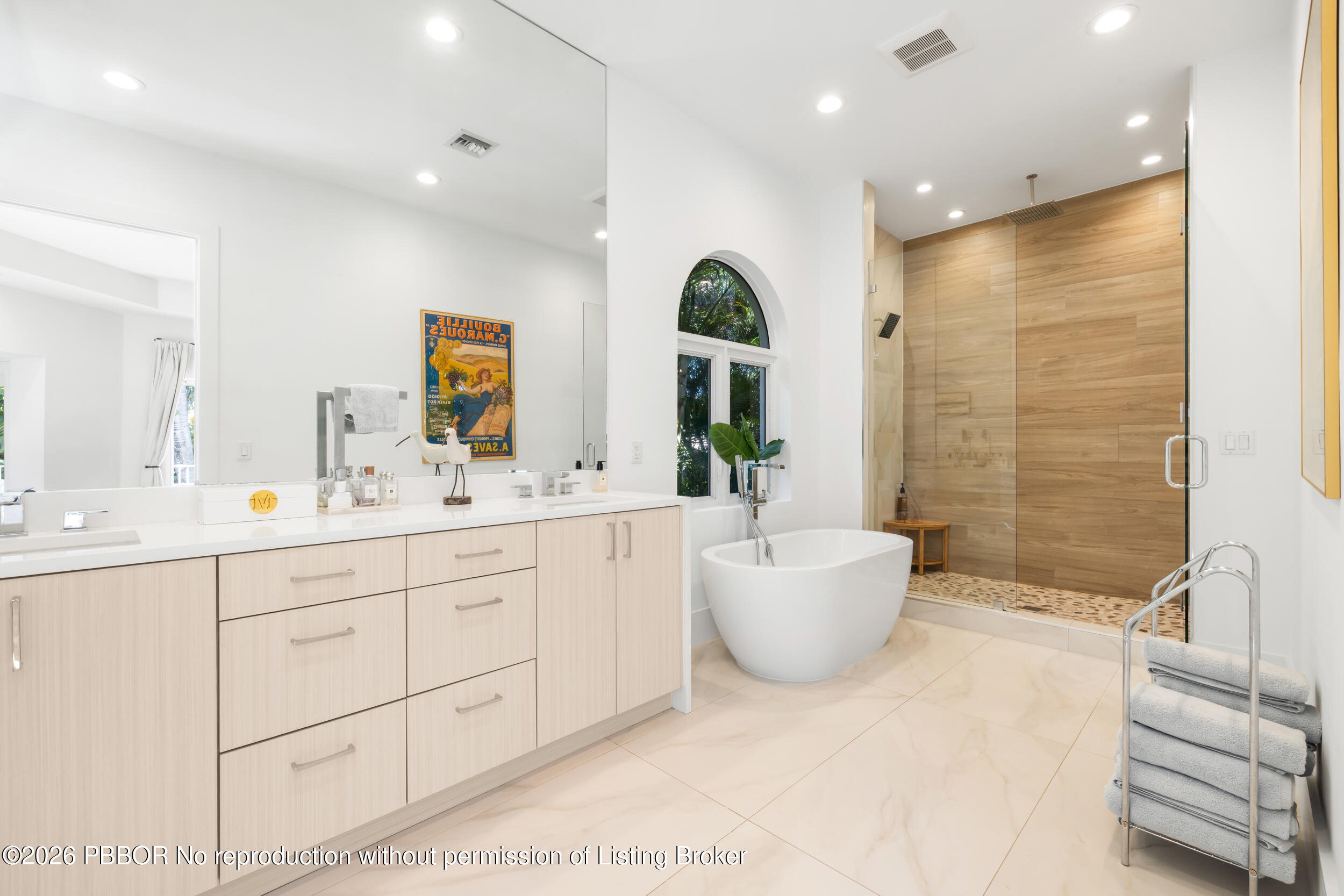 121 Seville Road West Palm Beach, FL 33405 - Photo 44 of 67 a bathroom with a double vanity sink a mirror and a bathtub