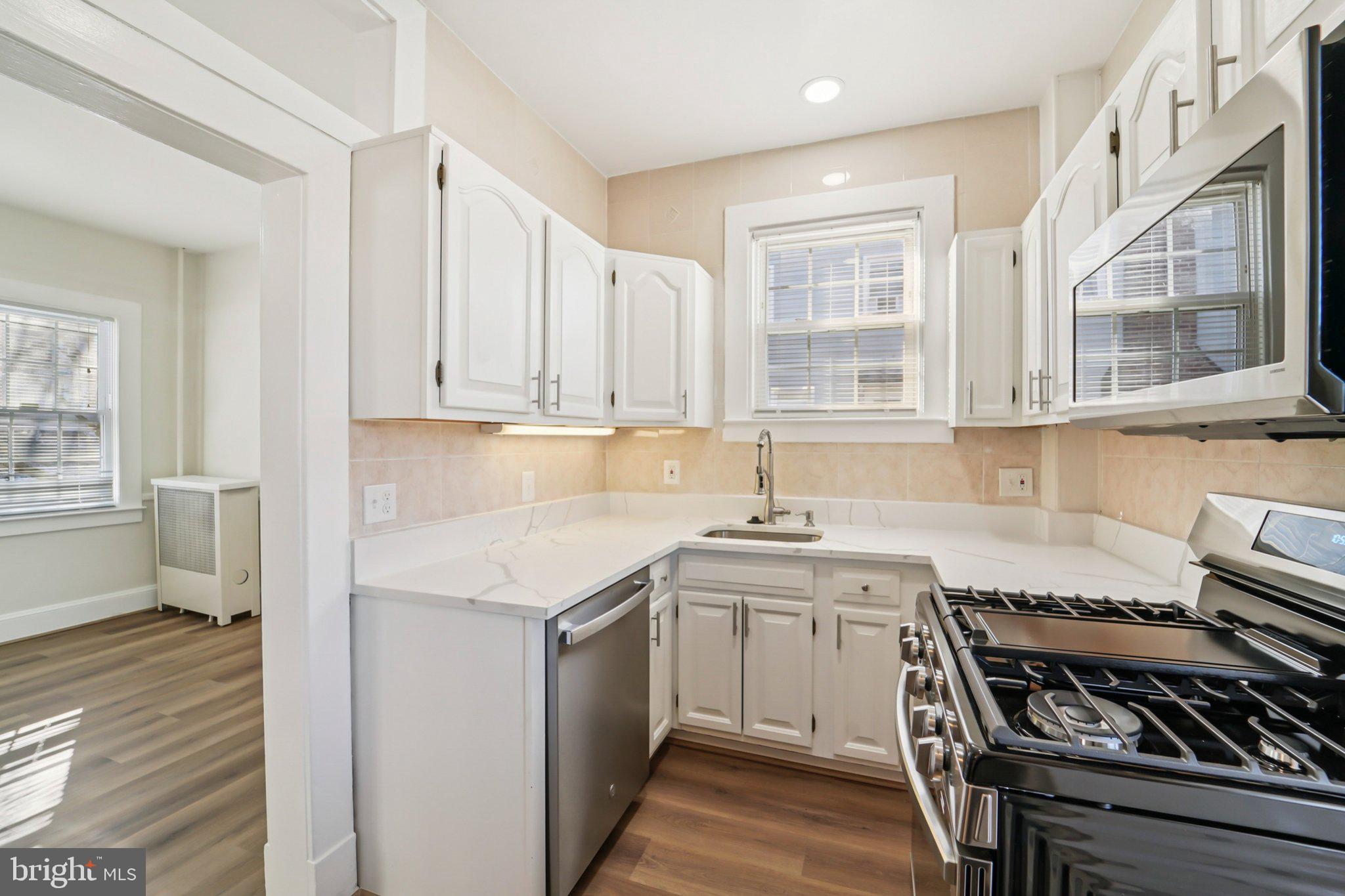 14 Summerfield Road Gwynn Oak, MD 21207 - Photo 12 of 54 a kitchen with stainless steel appliances granite countertop a stove and a sink