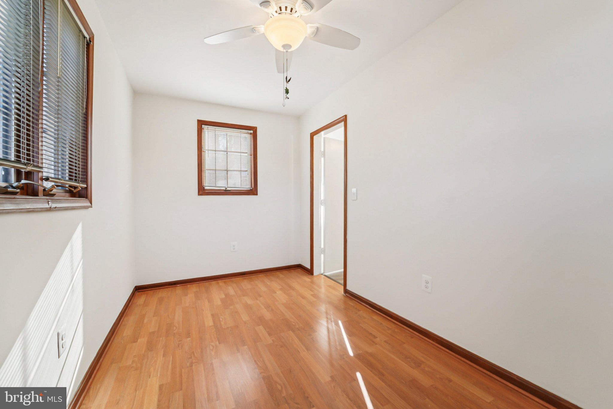 14 Summerfield Road Gwynn Oak, MD 21207 - Photo 15 of 54 a view of empty room with wooden floor and fan