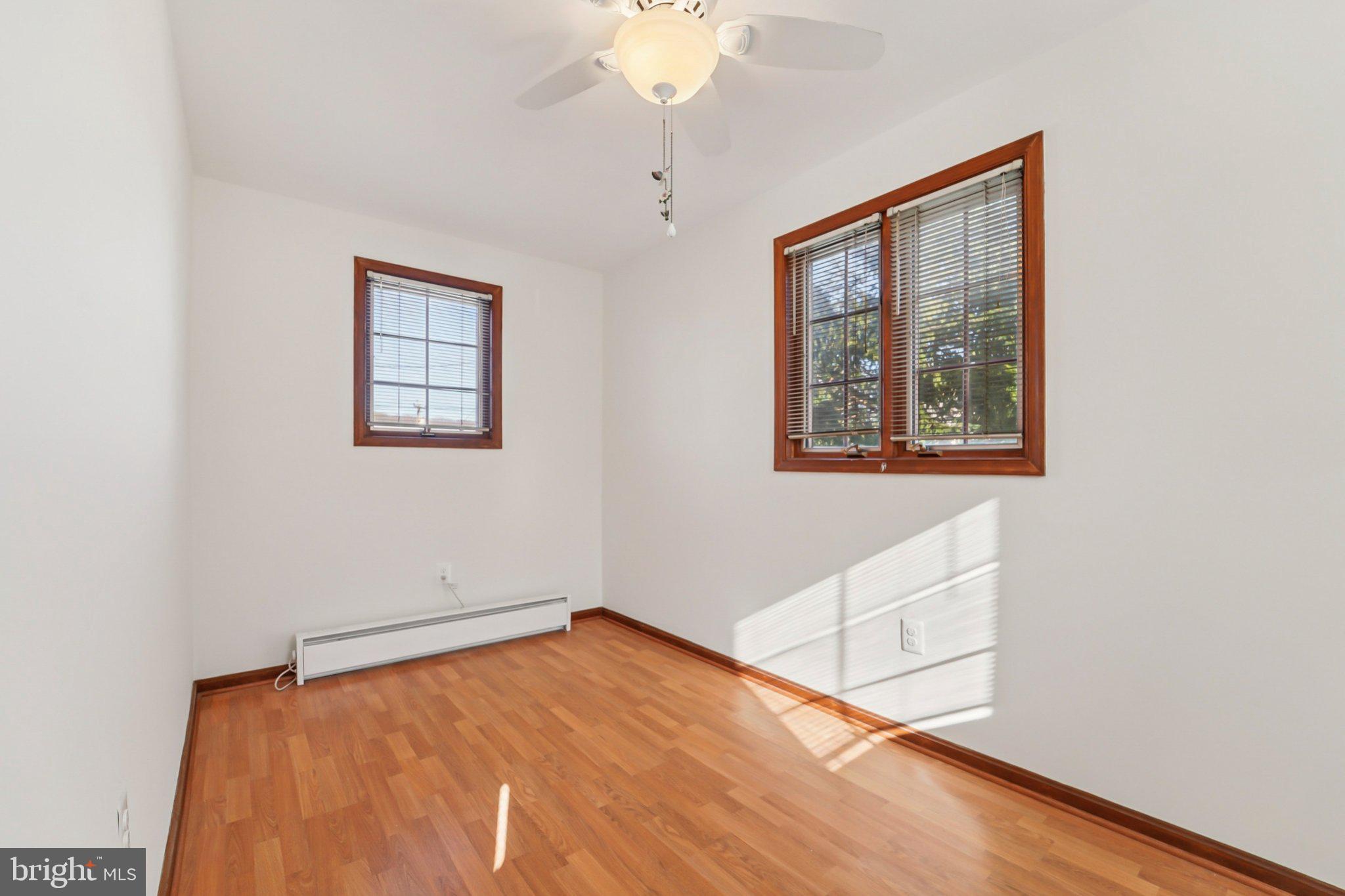14 Summerfield Road Gwynn Oak, MD 21207 - Photo 17 of 54 a view of an empty room with window and wooden floor