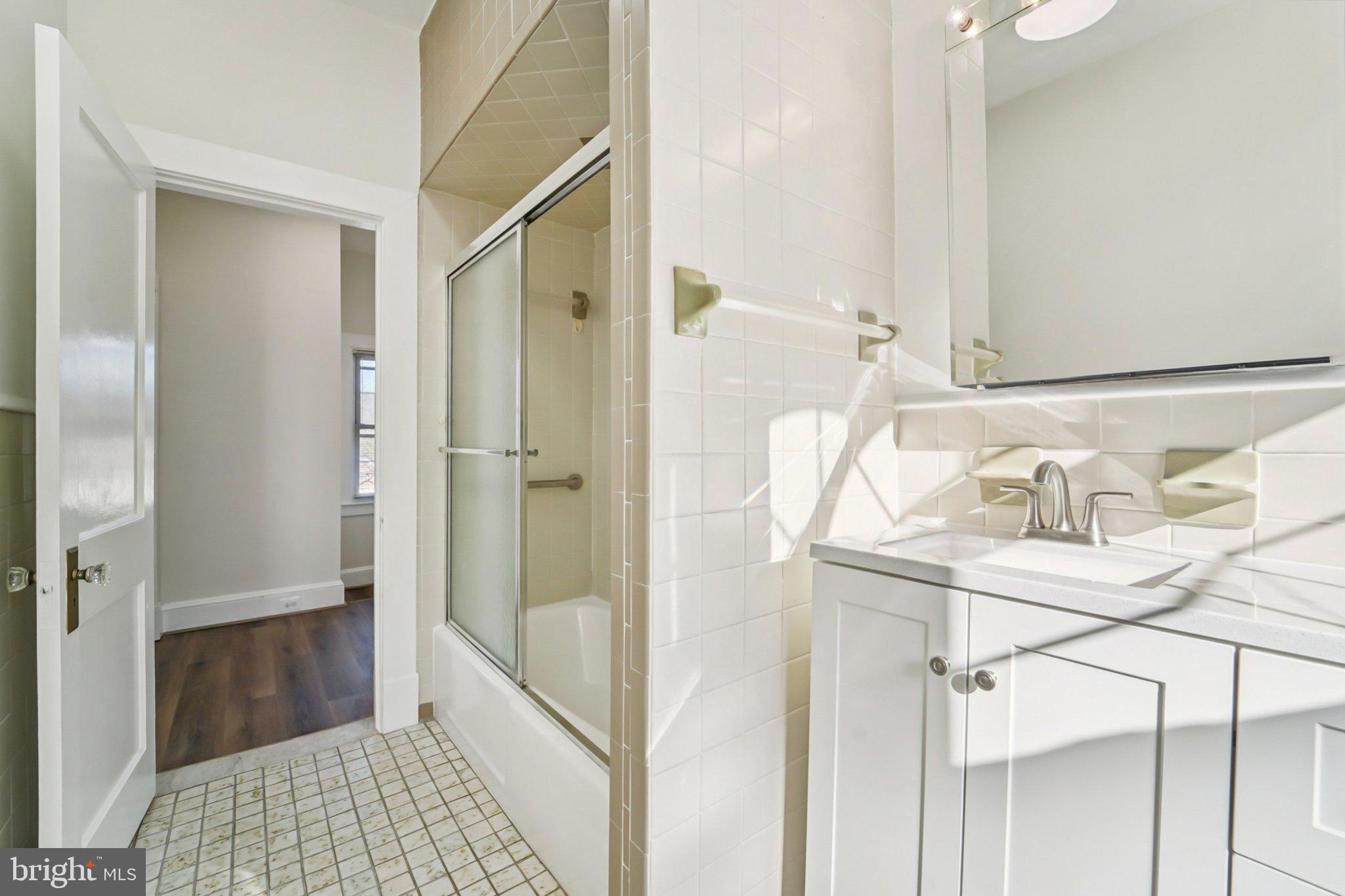 14 Summerfield Road Gwynn Oak, MD 21207 - Photo 18 of 54 a bathroom with a bathtub and a shower