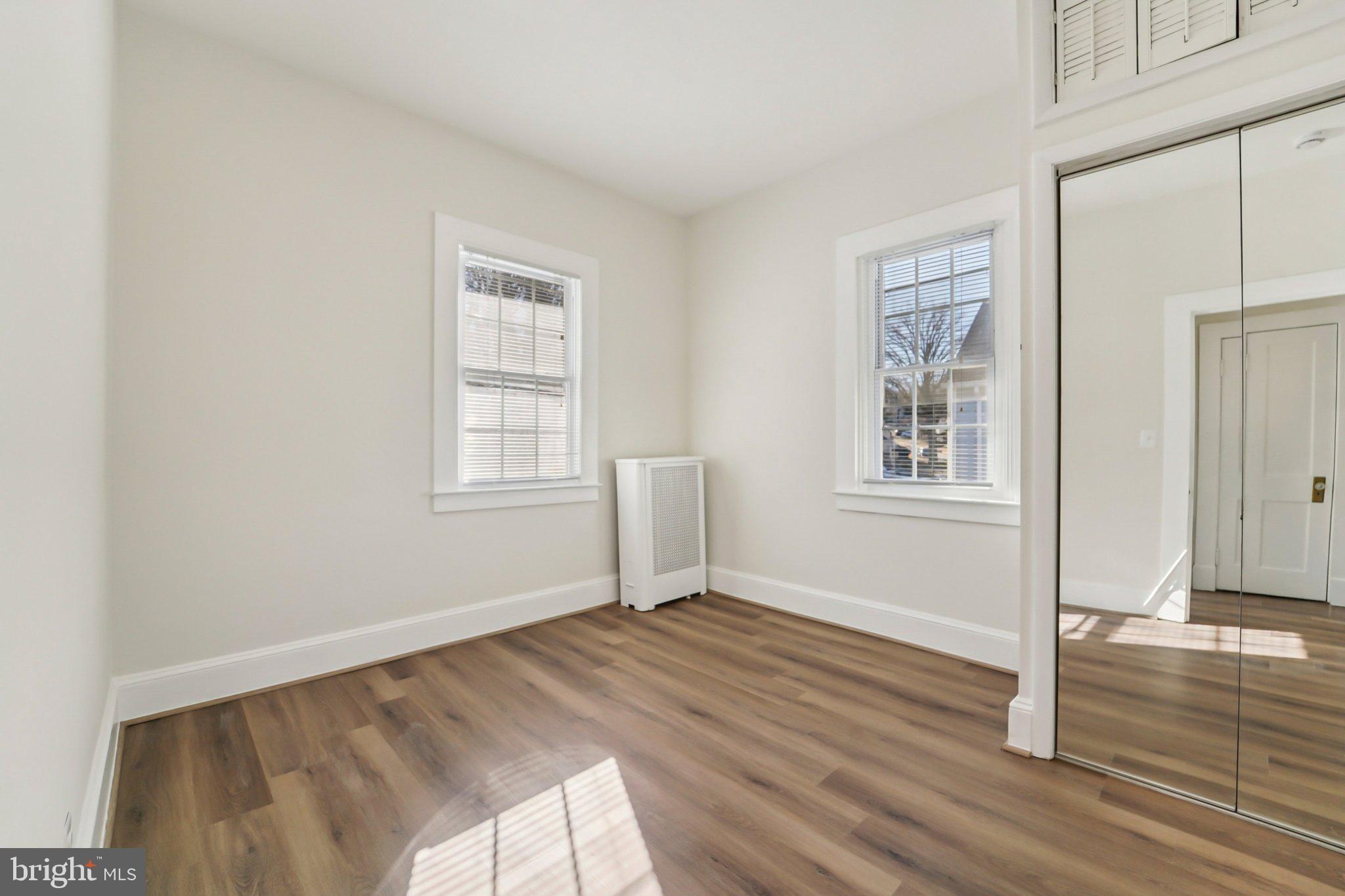 14 Summerfield Road Gwynn Oak, MD 21207 - Photo 19 of 54 a view of empty room with wooden floor and fan