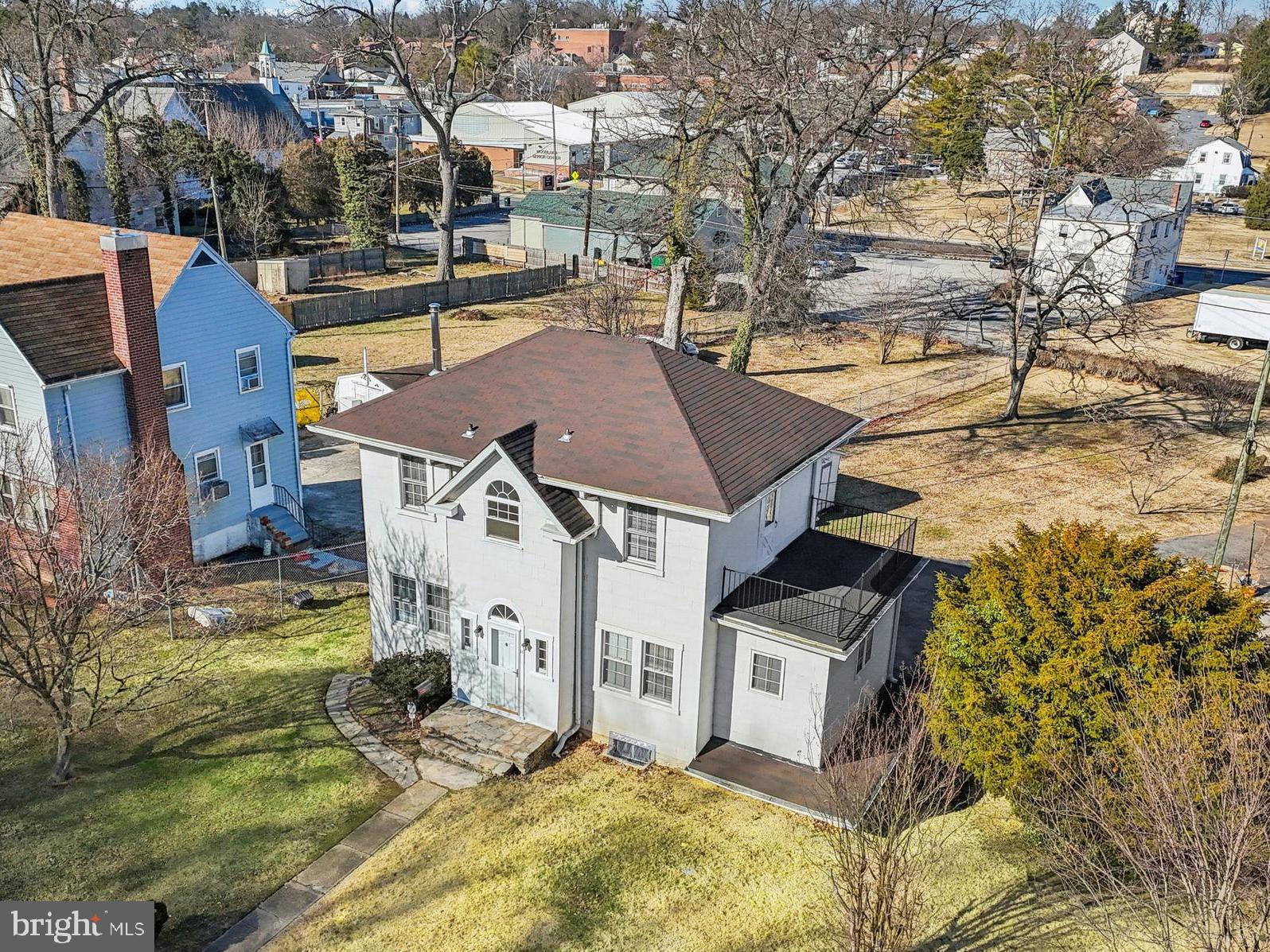 14 Summerfield Road Gwynn Oak, MD 21207 - Photo 40 of 54 aerial view of a house with a yard covered with snow in the outdoor space