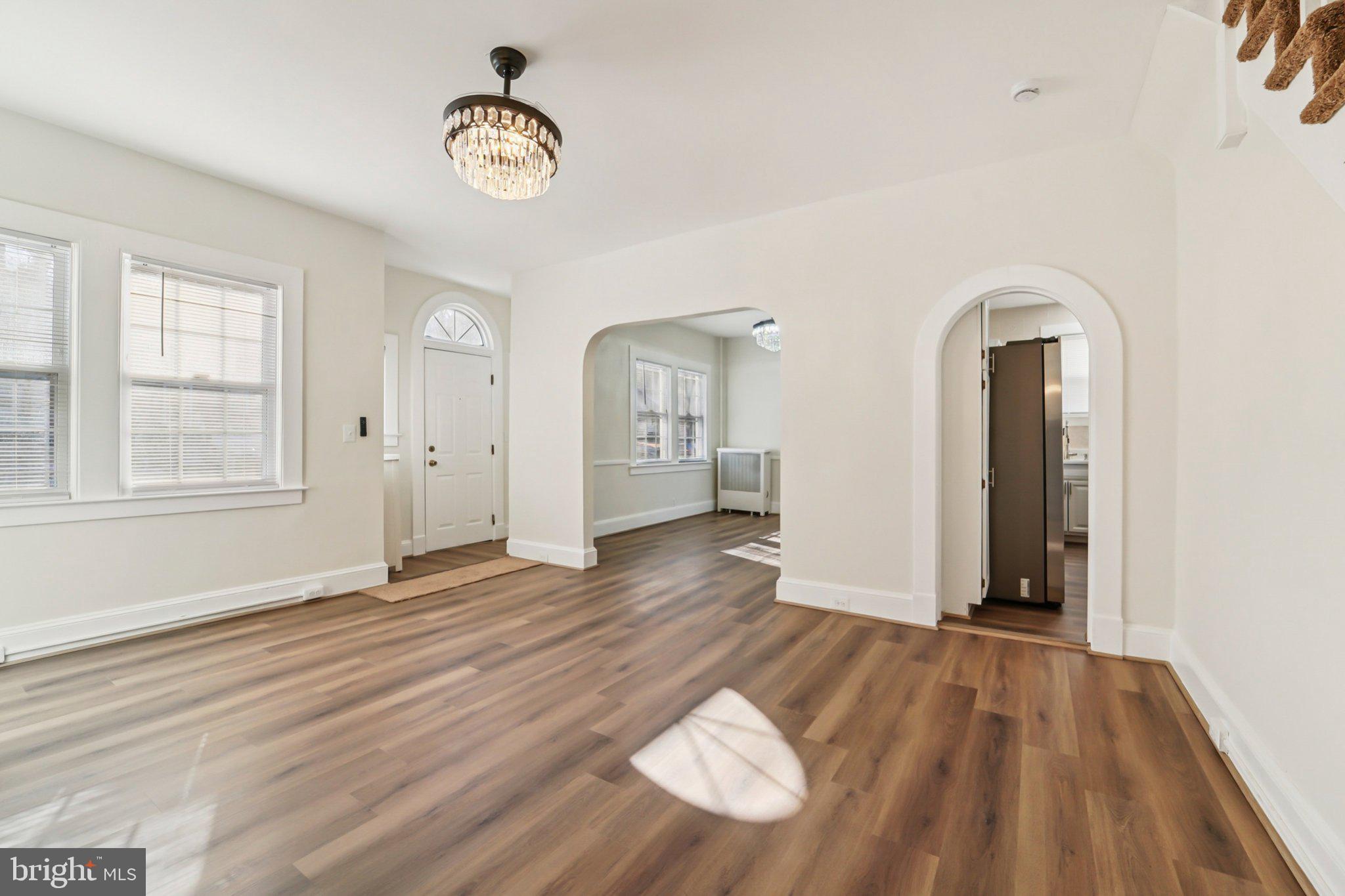 14 Summerfield Road Gwynn Oak, MD 21207 - Photo 6 of 54 a view of an empty room with wooden floor and a window