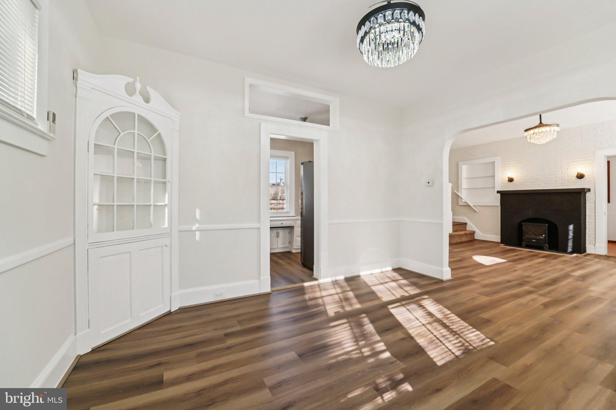 14 Summerfield Road Gwynn Oak, MD 21207 - Photo 10 of 54 a view of an empty room with a fireplace and a window