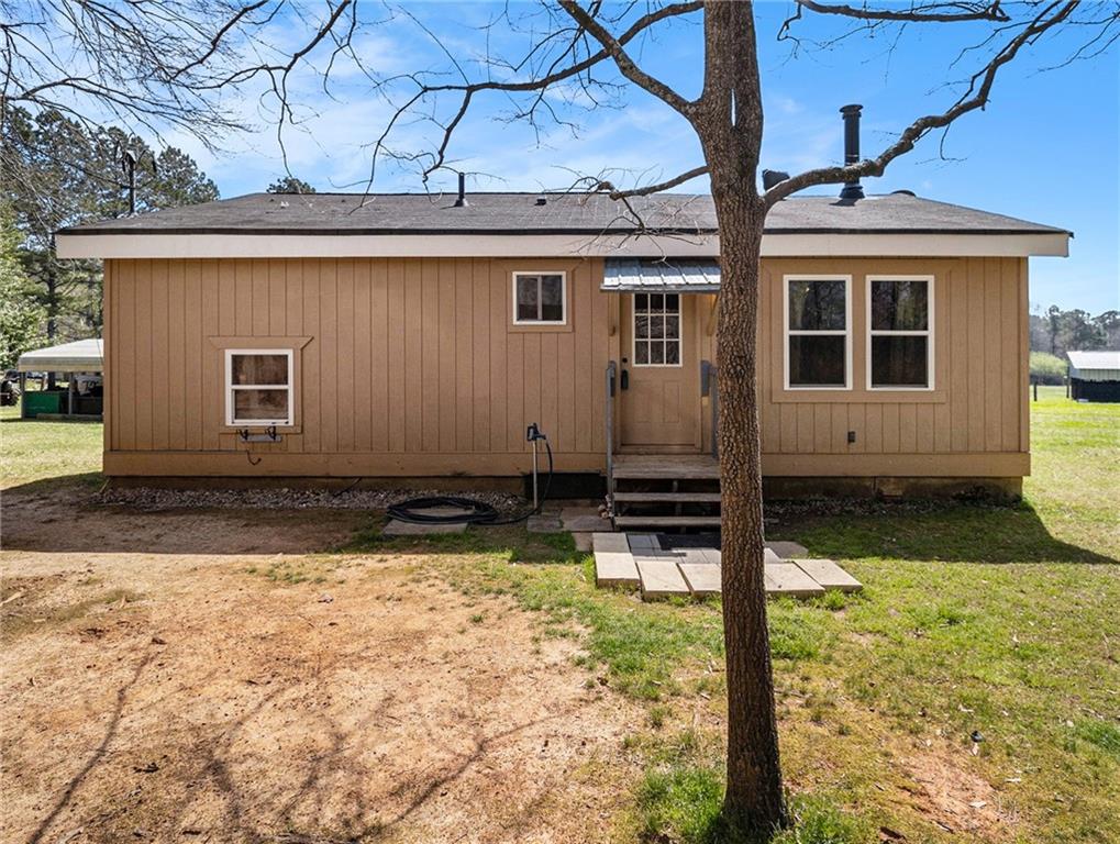a view of house with yard