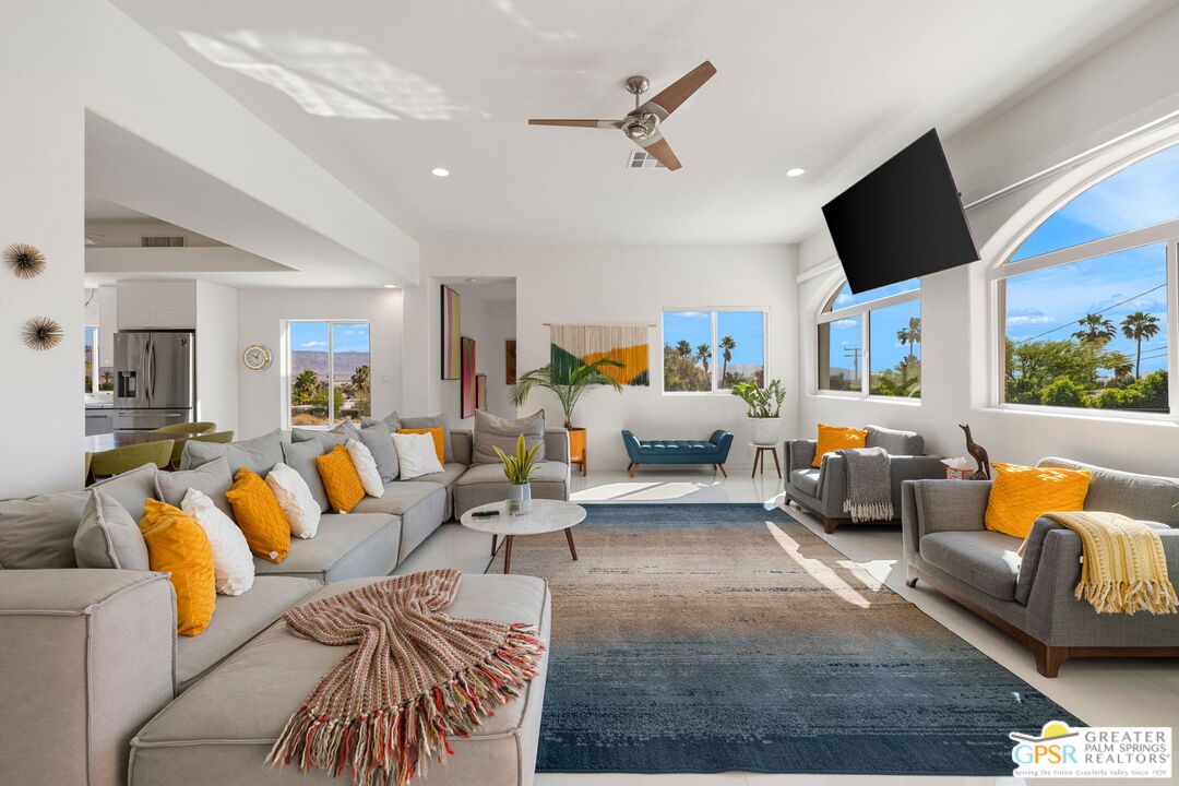 775 West Racquet Club Road Palm Springs, CA 92262 - Photo 20 of 44 a living room with furniture and a flat screen tv