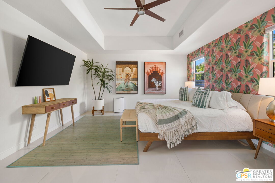 775 West Racquet Club Road Palm Springs, CA 92262 - Photo 21 of 44 a living room with furniture and a flat screen tv