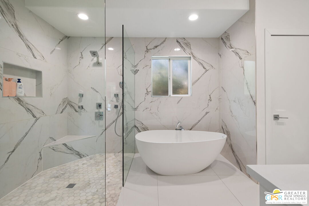 775 West Racquet Club Road Palm Springs, CA 92262 - Photo 24 of 44 a bathroom with a bathtub and shower