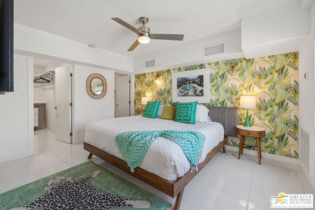 775 West Racquet Club Road Palm Springs, CA 92262 - Photo 33 of 44 a bed room with a bed and a chair