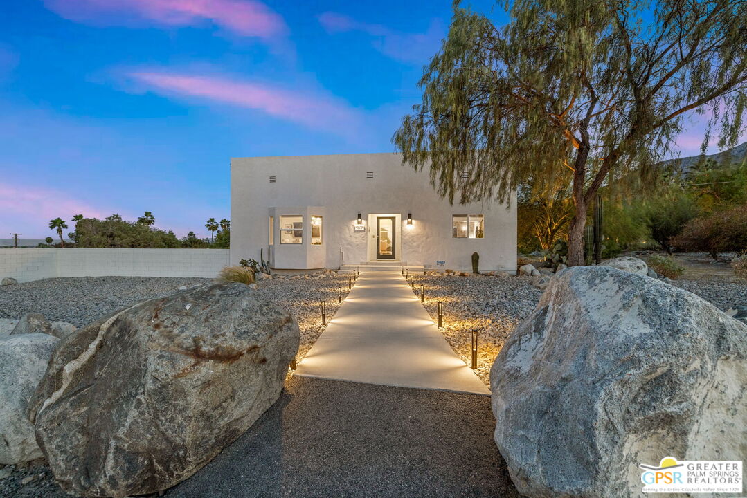 775 West Racquet Club Road Palm Springs, CA 92262 - Photo 38 of 44 a view of a yard with a house