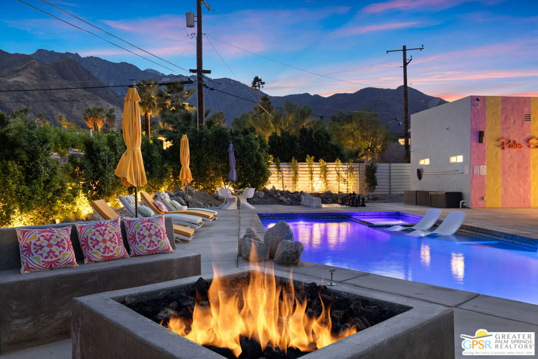 775 West Racquet Club Road Palm Springs, CA 92262 - Photo 4 of 44 a view of a chairs and table in the patio