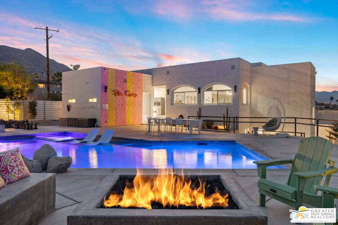 775 West Racquet Club Road Palm Springs, CA 92262 - Photo 5 of 44 a large pool with lawn chairs