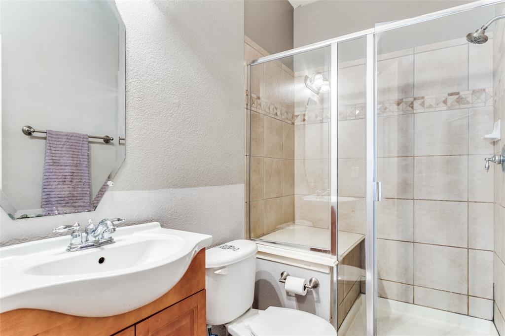 819 Hickory Street Burleson, TX 76028 - Photo 11 of 24 a bathroom with a sink toilet and shower
