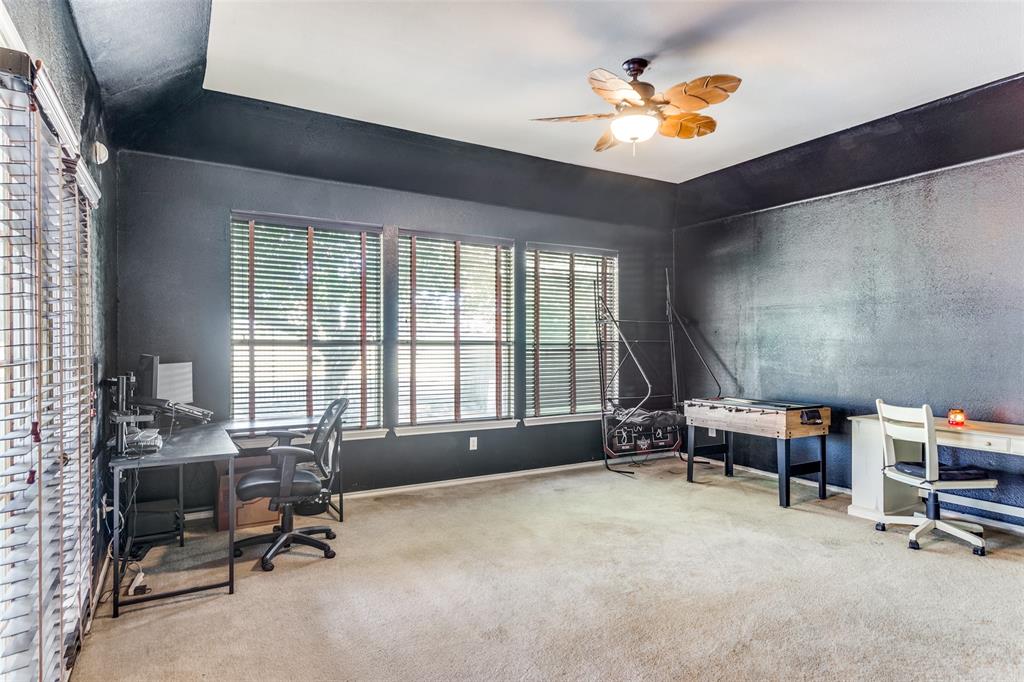 819 Hickory Street Burleson, TX 76028 - Photo 14 of 24 a workspace with furniture window and a ceiling fan