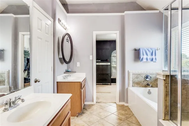 a bathroom with a tub sink toilet and mirror