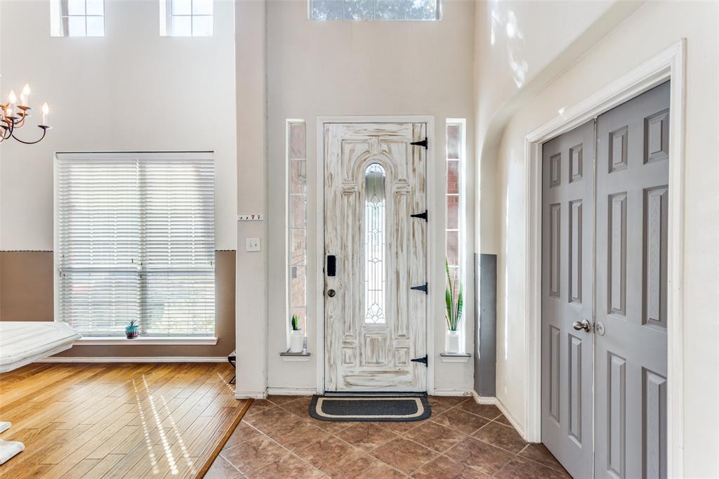 819 Hickory Street Burleson, TX 76028 - Photo 2 of 24 a view of a bathroom with tub and door