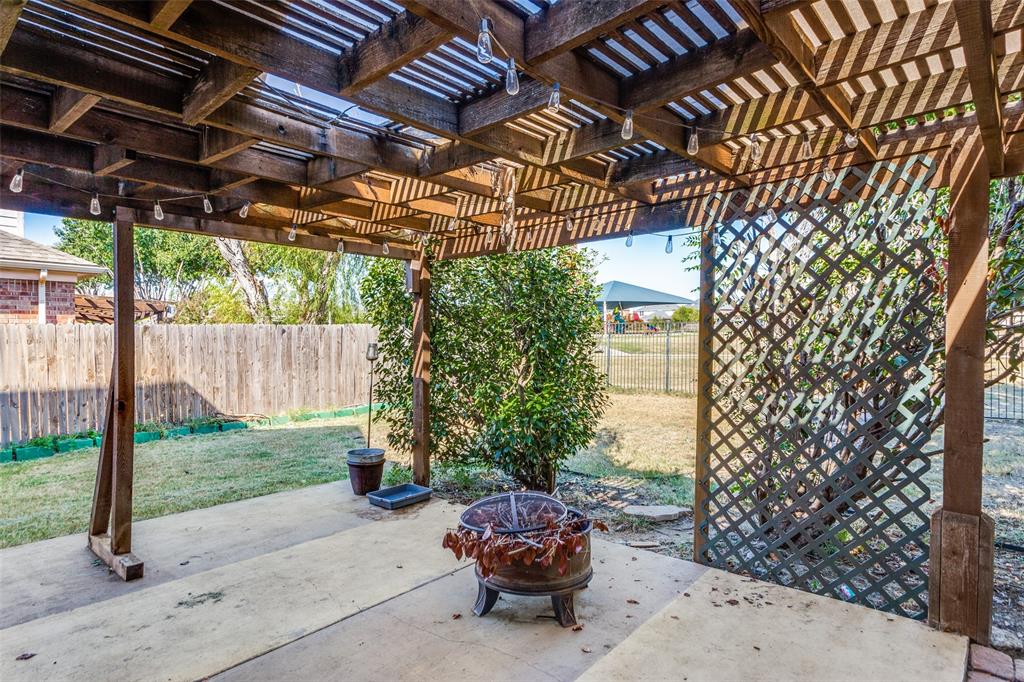 819 Hickory Street Burleson, TX 76028 - Photo 22 of 24 a car parked in front of a house with a yard