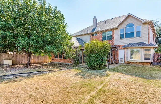 a view of a yard in front of a house
