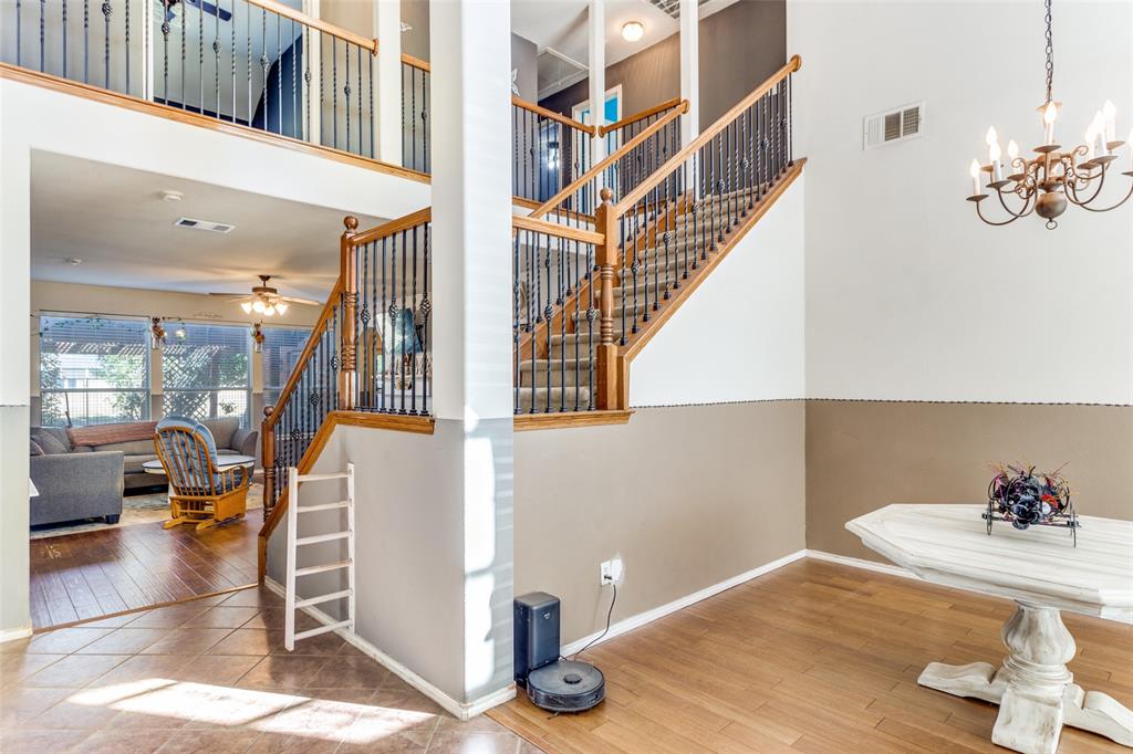 819 Hickory Street Burleson, TX 76028 - Photo 4 of 24 a view of entryway and hall with wooden floor