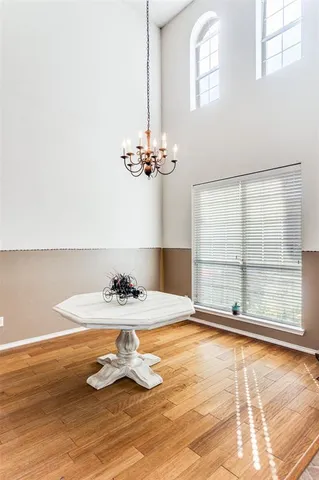 a view of a room with wooden floor and cabinet