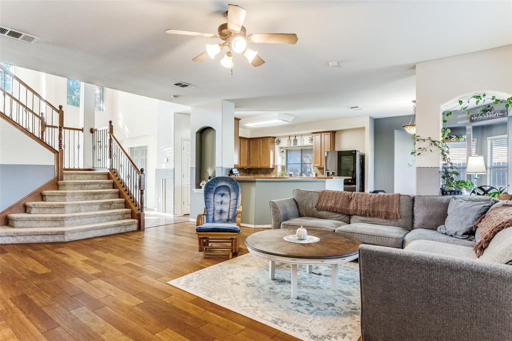 819 Hickory Street Burleson, TX 76028 - Photo 7 of 24 a living room with furniture and a dining table