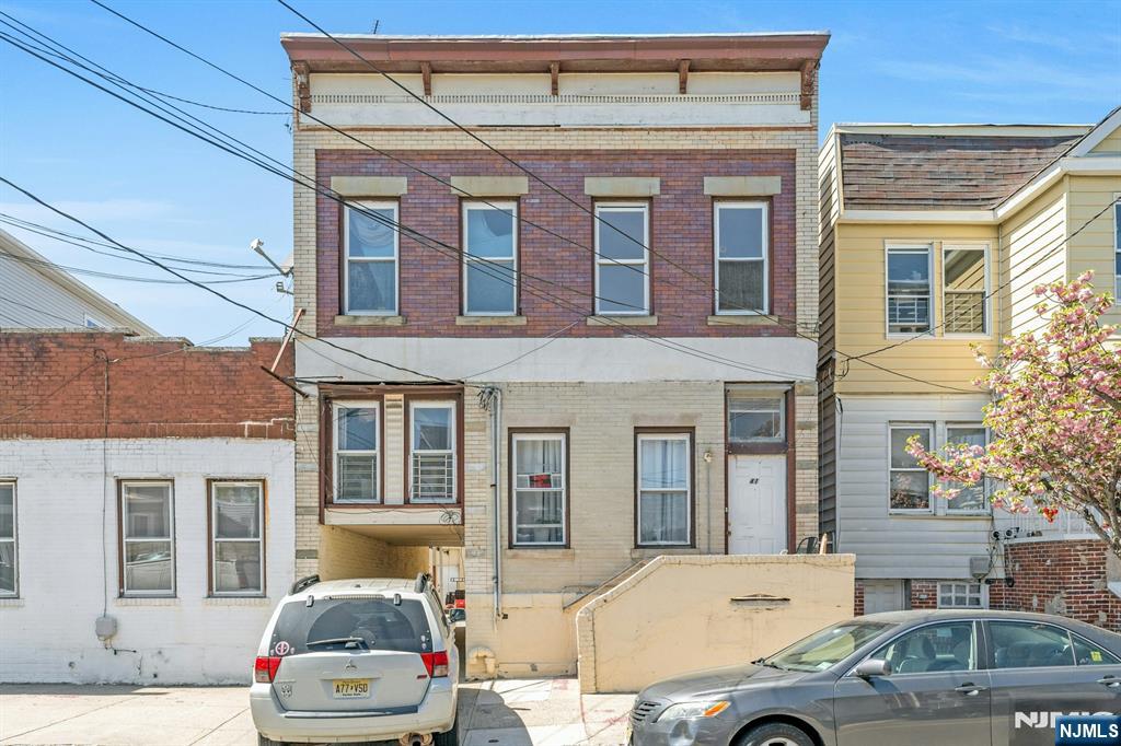 a front view of a house with outdoor space