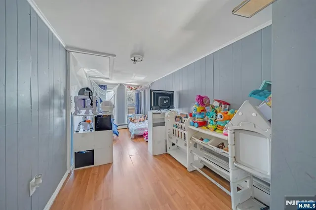 a storage room with wooden floor and furniture