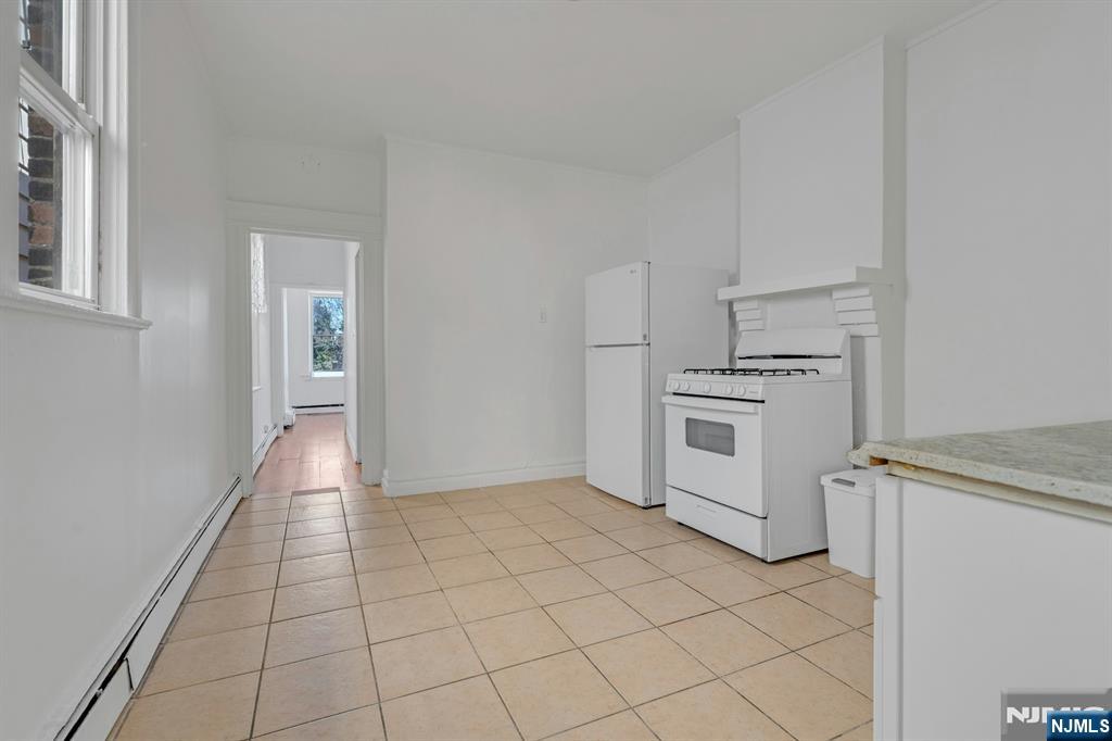 41 Heckel Street Belleville, NJ 07109 - Photo 15 of 38 a view of a kitchen with white cabinets