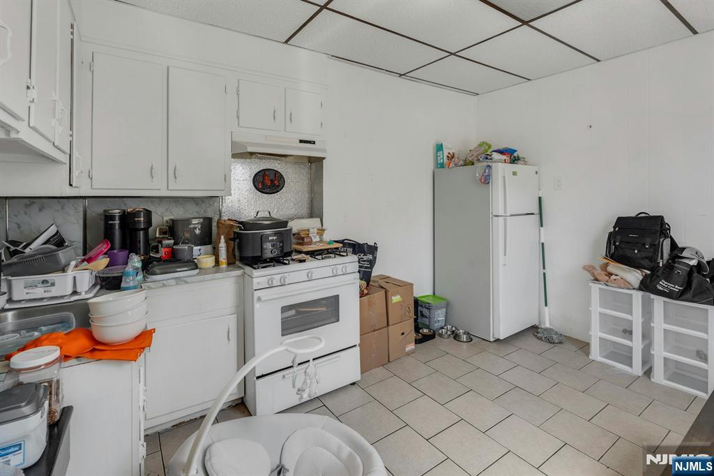 41 Heckel Street Belleville, NJ 07109 - Photo 21 of 38 a kitchen with stainless steel appliances granite countertop a stove and a refrigerator