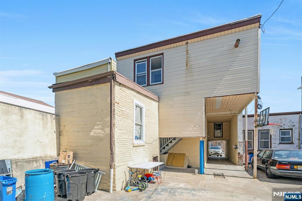 41 Heckel Street Belleville, NJ 07109 - Photo 31 of 38 a view of a patio with a table and chairs and potted plants