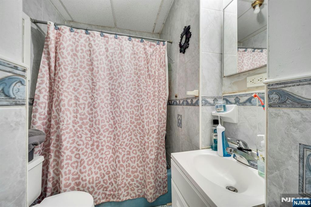 41 Heckel Street Belleville, NJ 07109 - Photo 34 of 38 a bathroom with a sink toilet and shower