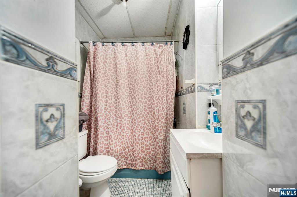 41 Heckel Street Belleville, NJ 07109 - Photo 9 of 38 a bathroom with a sink toilet and shower