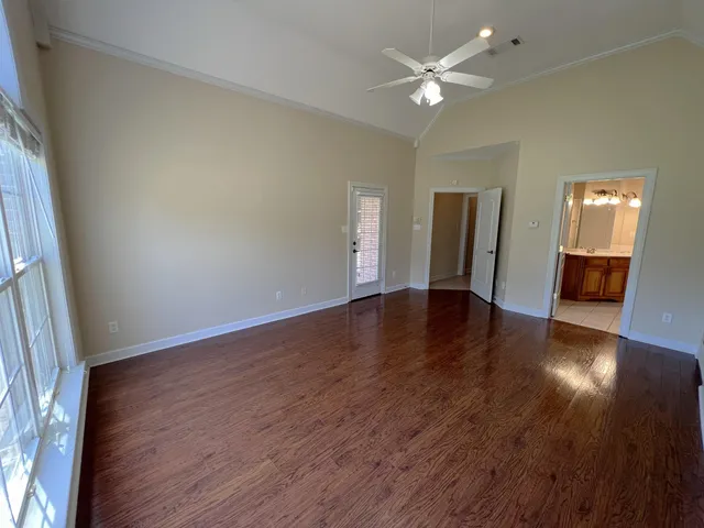 a bathroom with a double vanity sink mirror and a bathtub