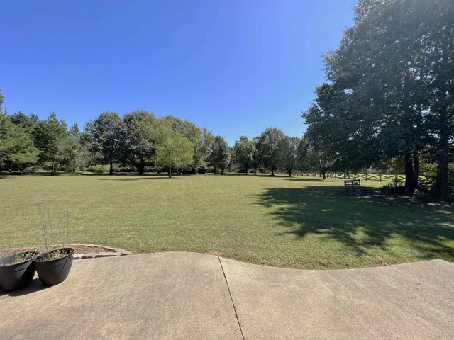 a view of an ocean with a swimming pool and valleys in the background