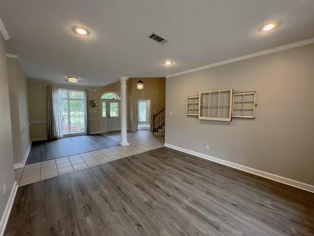 a kitchen with stainless steel appliances granite countertop a stove a sink a oven and a refrigerator