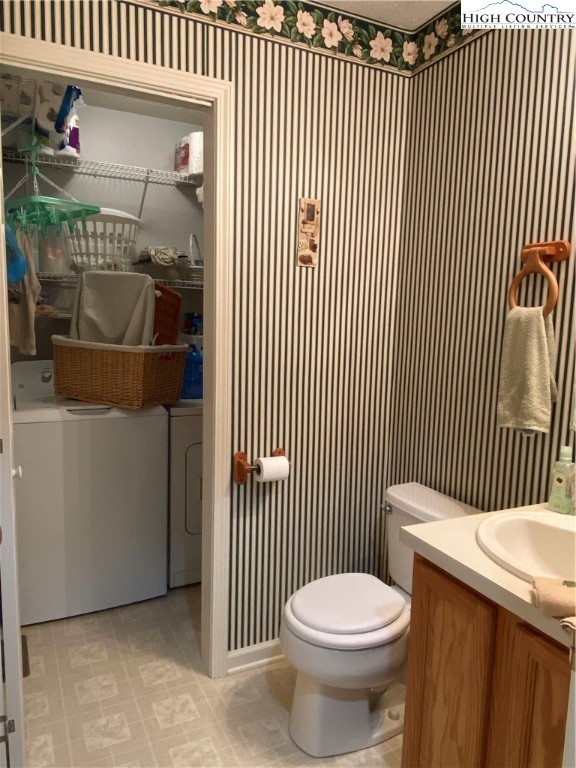 1241 Glade Creek School Road Ennice, NC 28623 - Photo 16 of 49 a bathroom with a toilet and a sink
