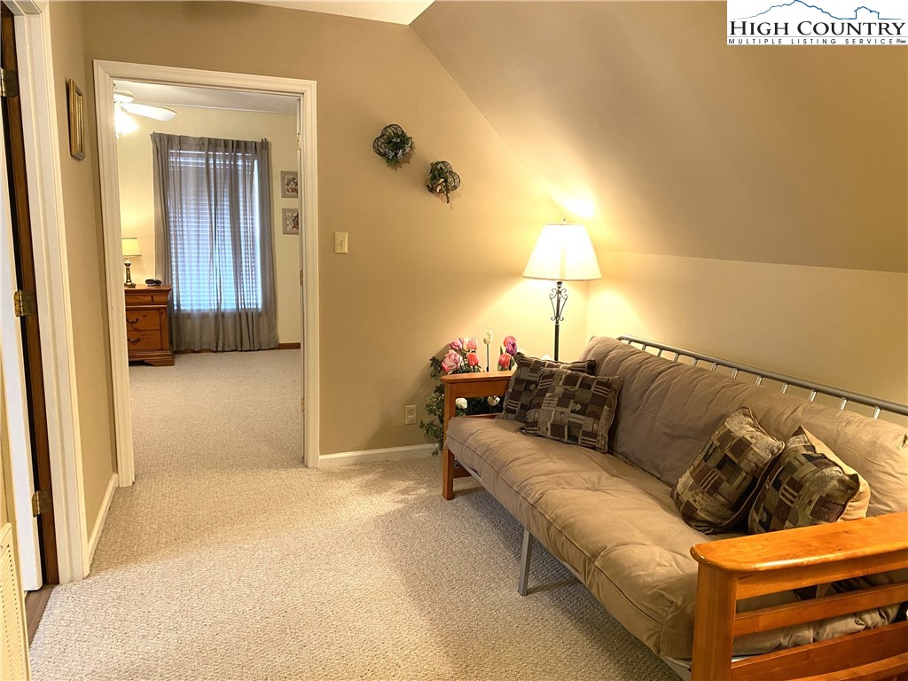 1241 Glade Creek School Road Ennice, NC 28623 - Photo 25 of 49 a living room with a couch and a walk in closet