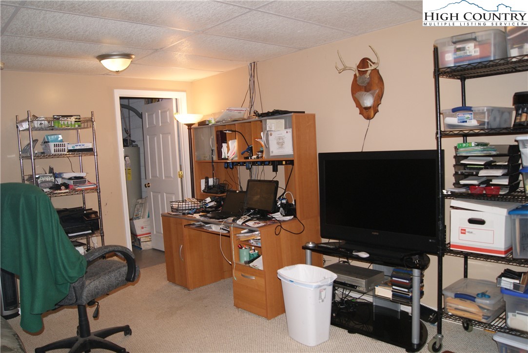 1241 Glade Creek School Road Ennice, NC 28623 - Photo 30 of 49 a room with furniture and a flat screen tv