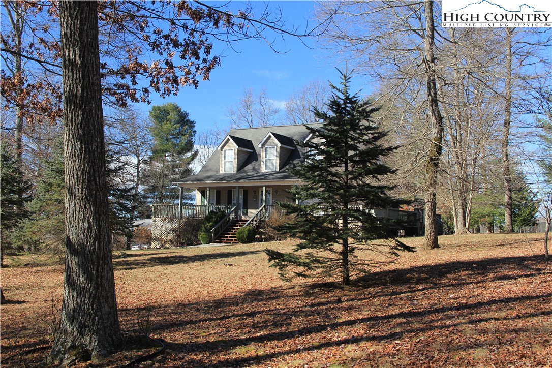 1241 Glade Creek School Road Ennice, NC 28623 - Photo 3 of 49 a view of a house with a yard