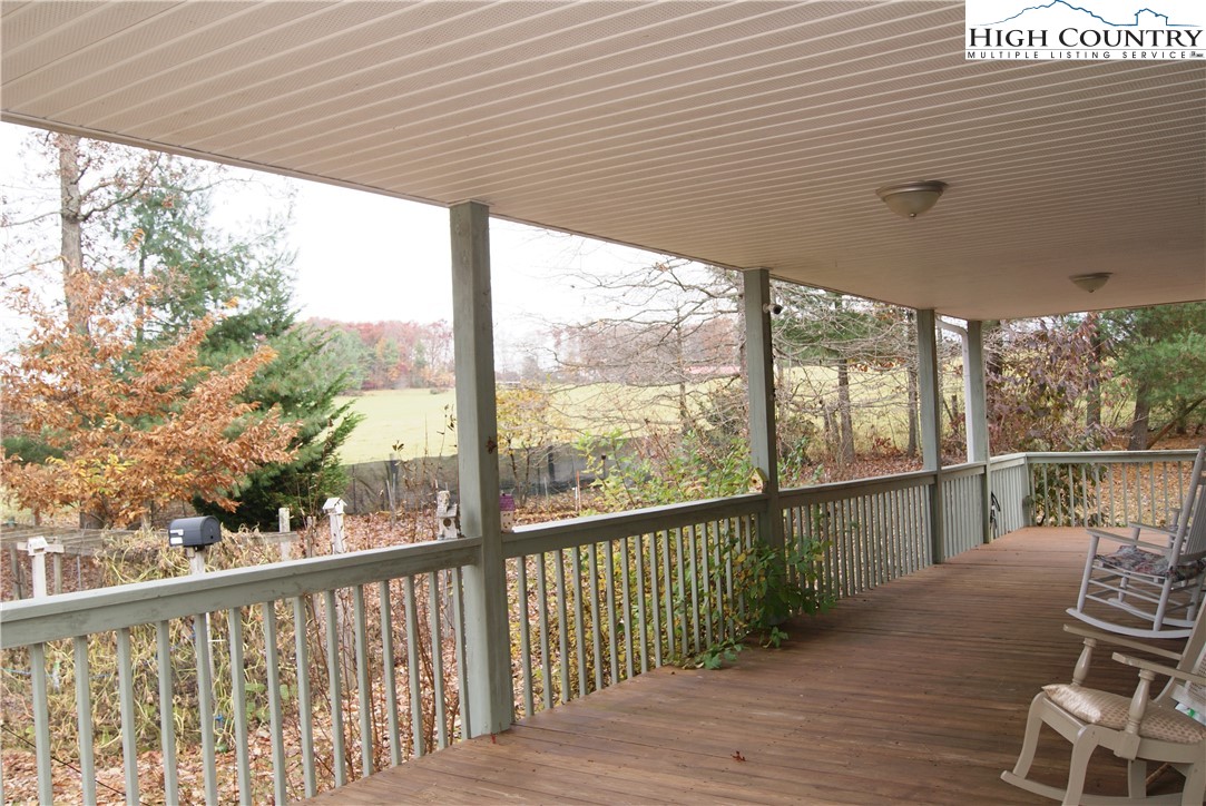 1241 Glade Creek School Road Ennice, NC 28623 - Photo 32 of 49 a view of a balcony with wooden floor