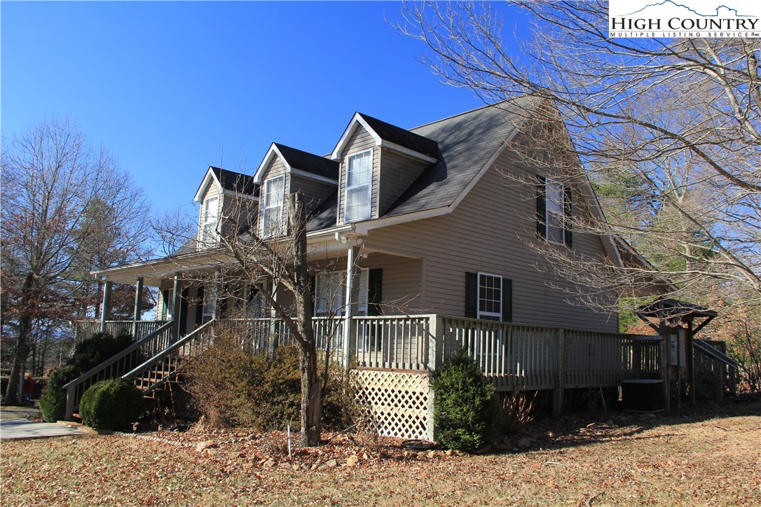 1241 Glade Creek School Road Ennice, NC 28623 - Photo 47 of 49 a front view of a house with a yard