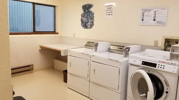 a utility room with dryer and washer