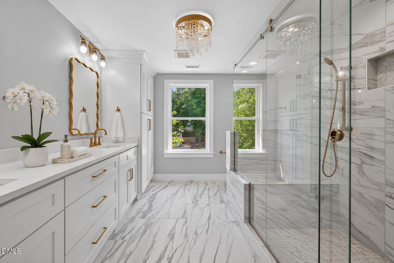 313 Crown Oaks Drive Raleigh, NC 27615 - Photo 18 of 60 a spacious bathroom with a granite countertop sink a large mirror a bathtub and next to a window