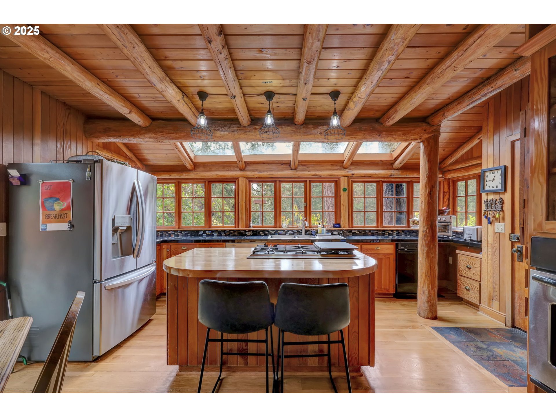 84771 Murdock Road Eugene, OR 97405 - Photo 16 of 46 a dining room with a wooden table and chairs