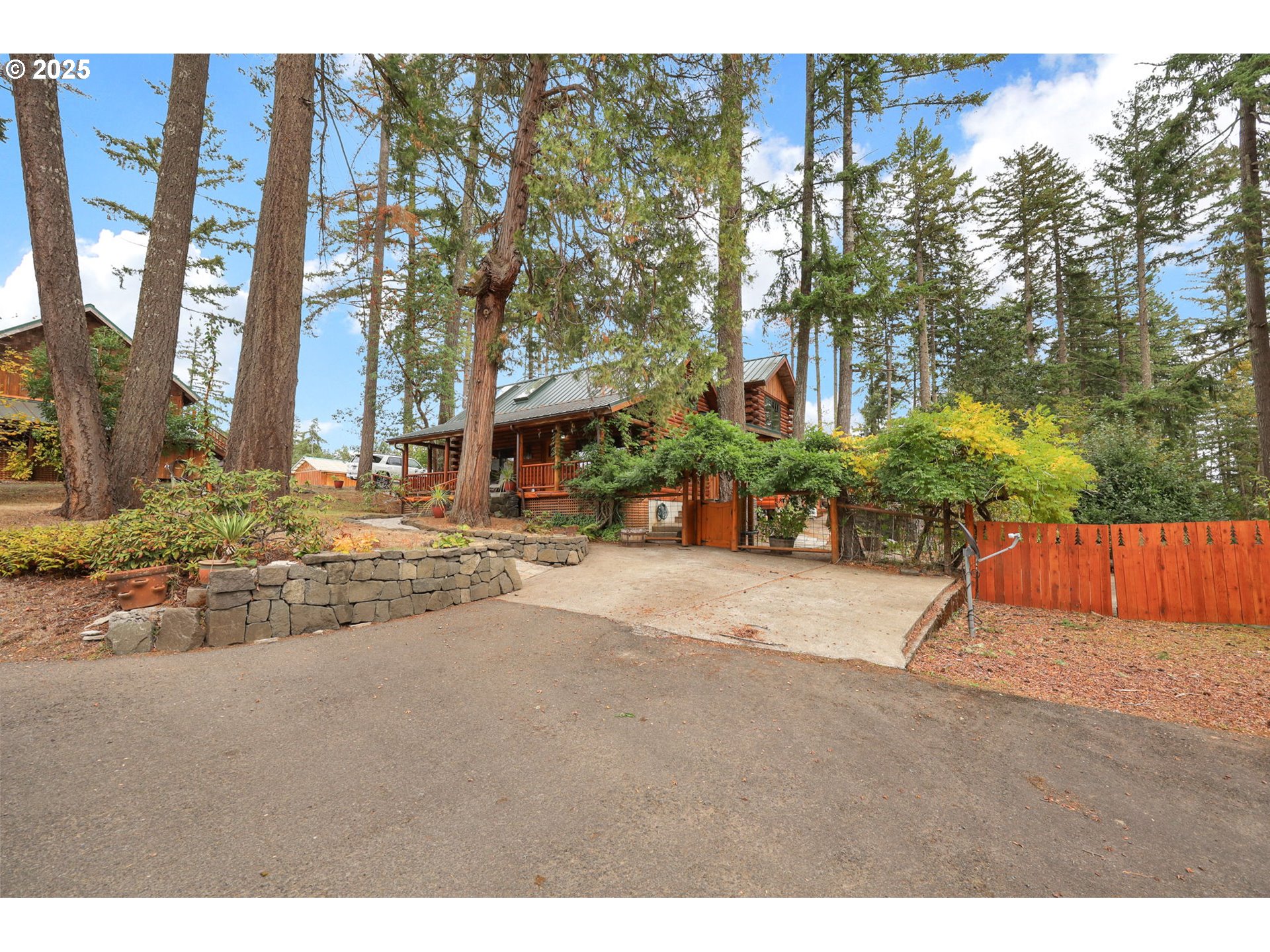84771 Murdock Road Eugene, OR 97405 - Photo 2 of 46 a street view with large trees