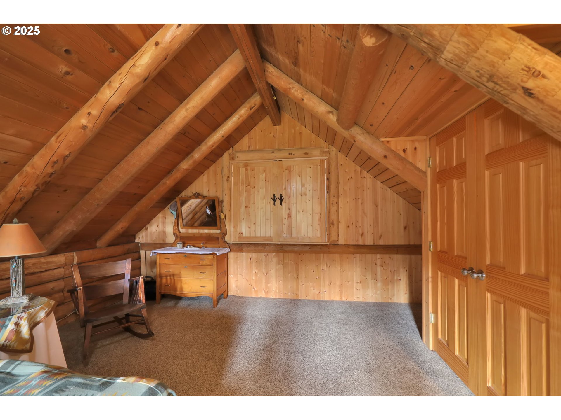 84771 Murdock Road Eugene, OR 97405 - Photo 31 of 46 a view of an empty room with wooden floor