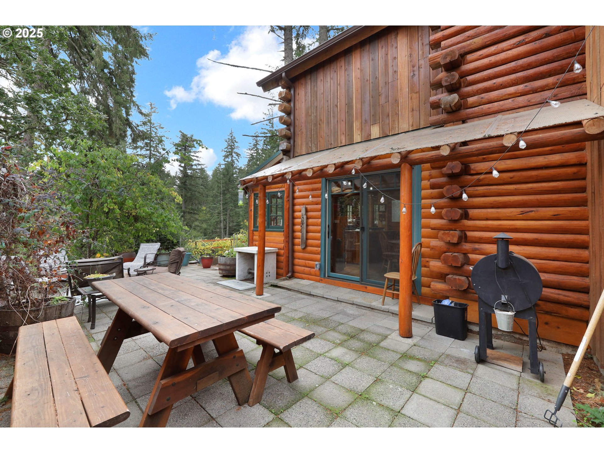 84771 Murdock Road Eugene, OR 97405 - Photo 34 of 46 a backyard of a house with barbeque oven table and chairs