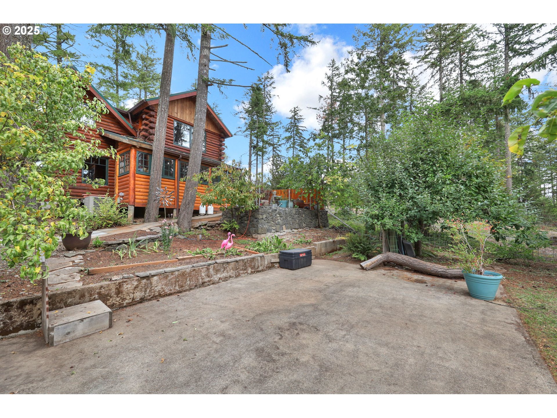 84771 Murdock Road Eugene, OR 97405 - Photo 38 of 46 a view of a house with a yard and sitting area