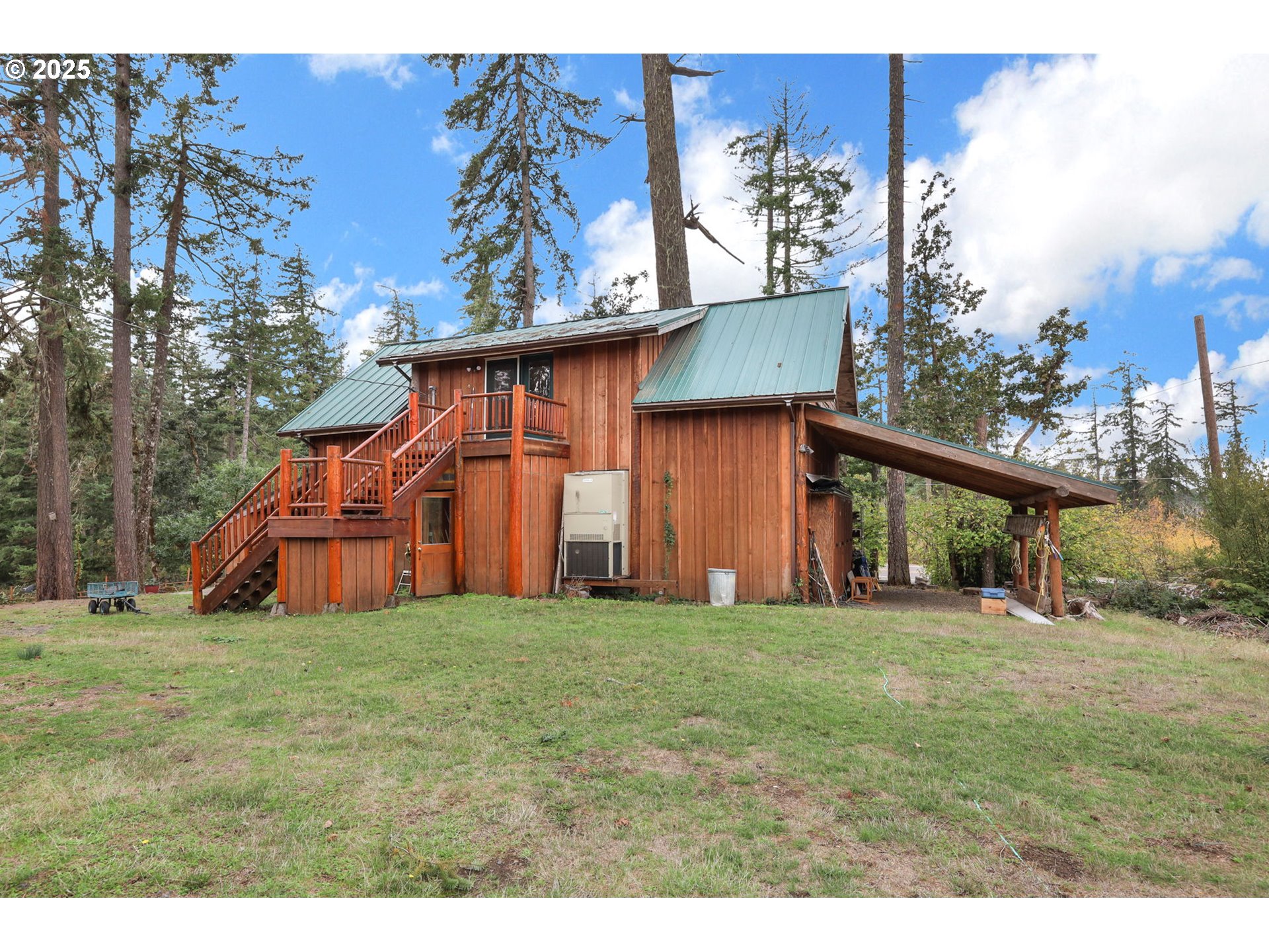 84771 Murdock Road Eugene, OR 97405 - Photo 39 of 46 a view of a house with a yard and deck